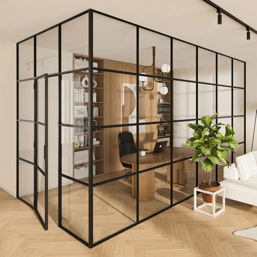 Black glazed loft partition enclosing a home-office corner